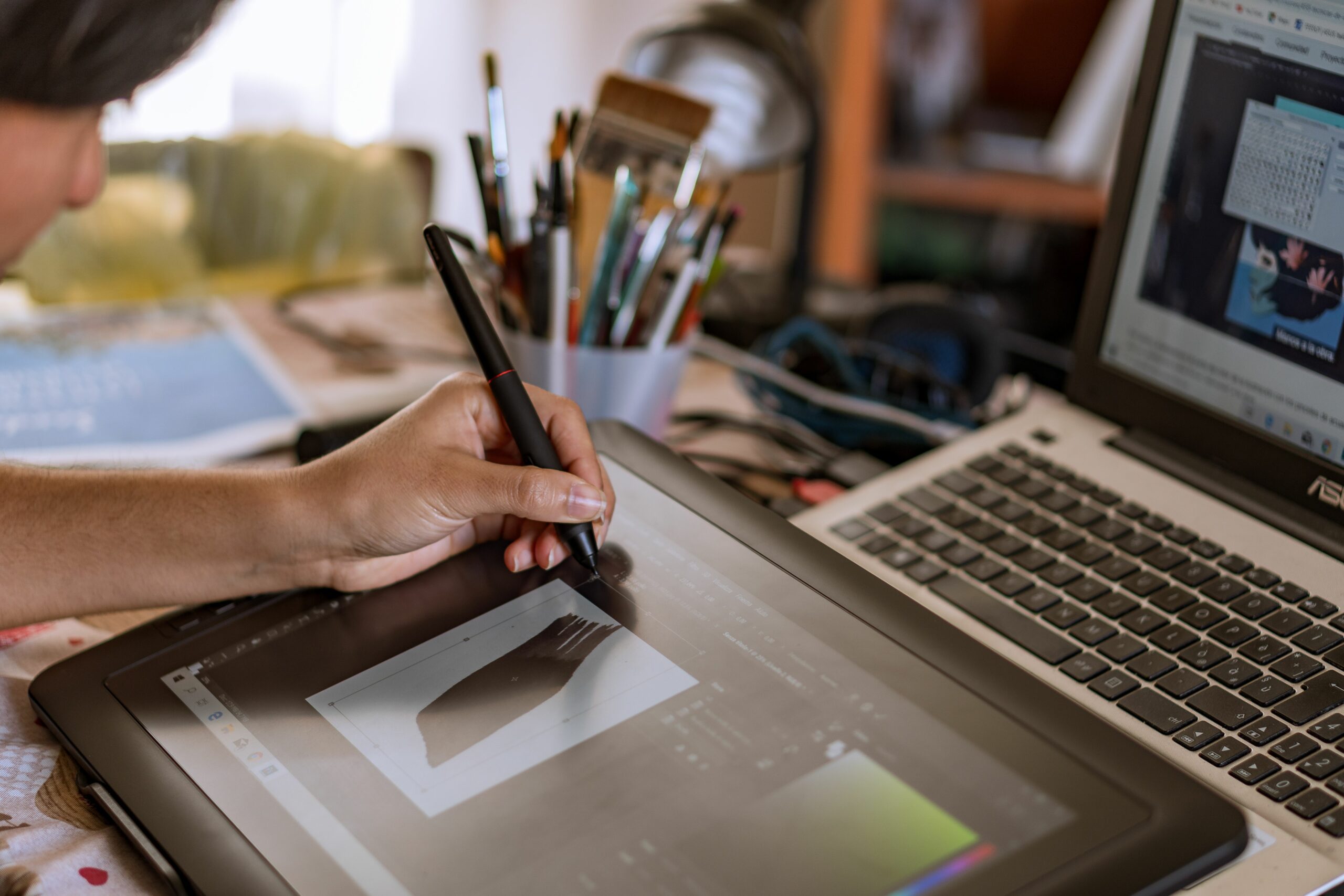 An artist's hand meticulously crafts a pattern on her tablet, blending creativity and technology seamlessly. SMCV, Italy, August 18th 2023