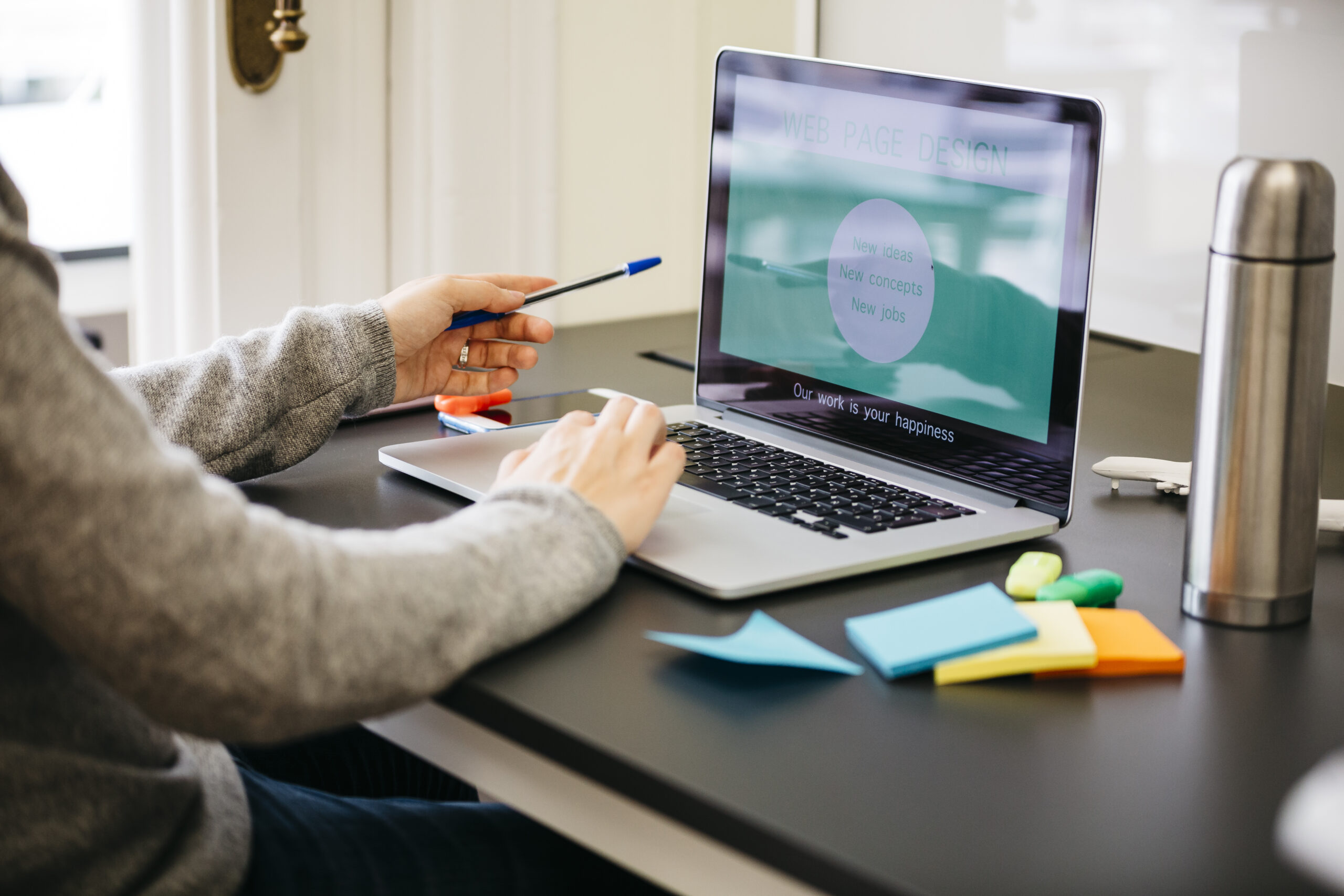 Businesswoman working in office, using laptop