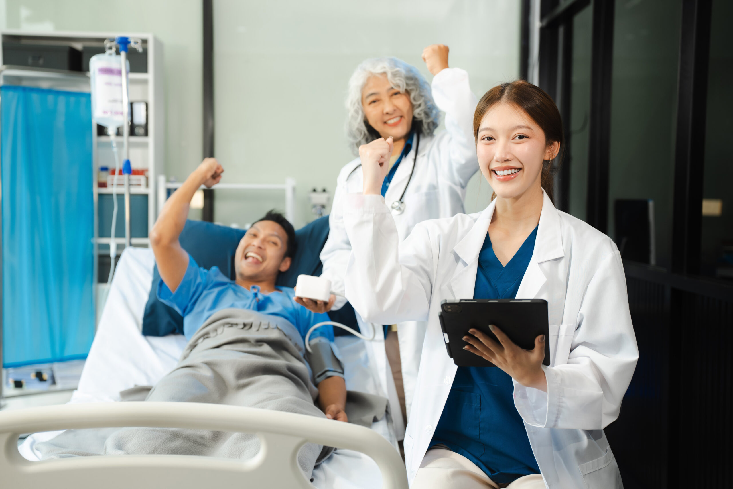 medicine, healthcare and people concept - doctor talking to male patient at bed in hospital.